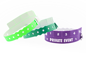 Custom 5-tab vinyl wristbands with numbered detachable tabs for redemption and access control, shown in green and purple with snap closure