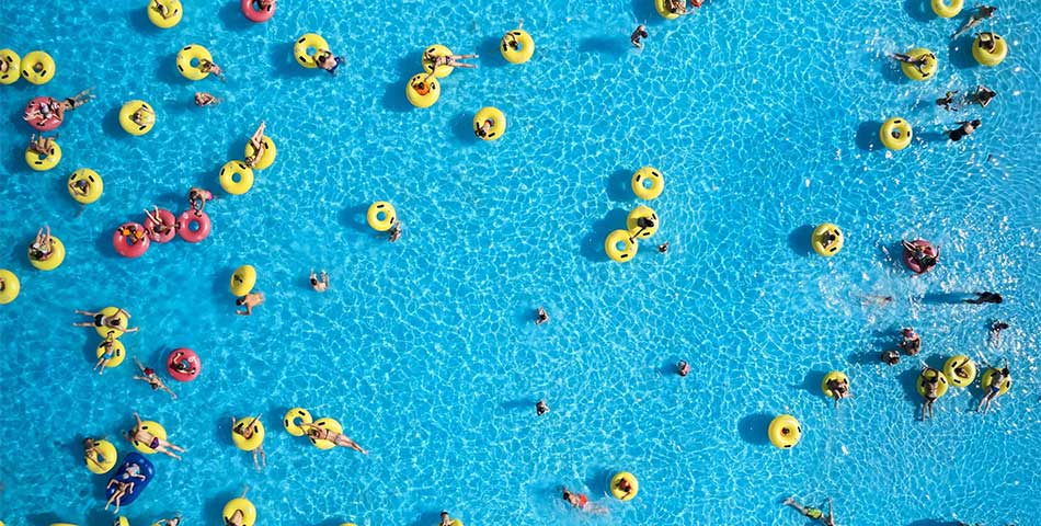 Aerial view of guests in a wave pool at a water park